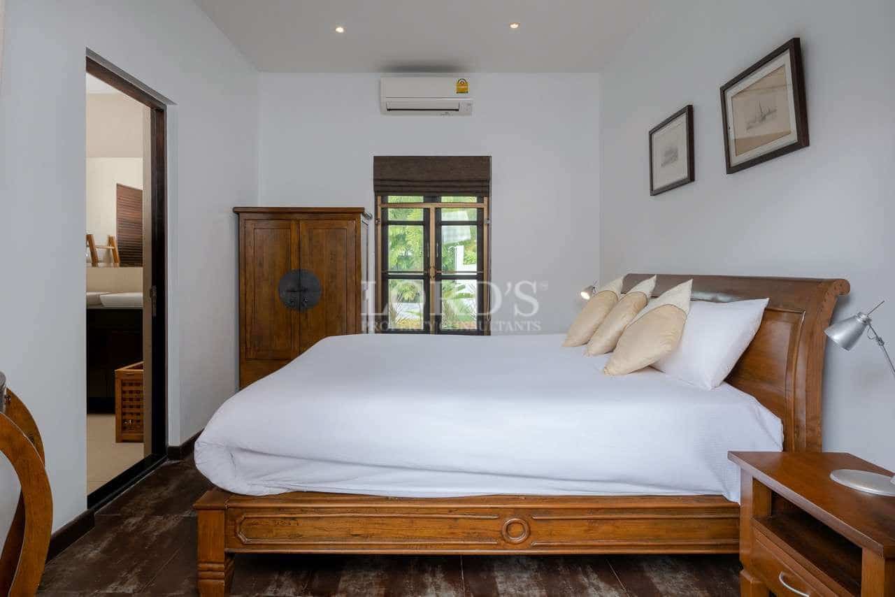 Cozy bedroom with wooden furniture.