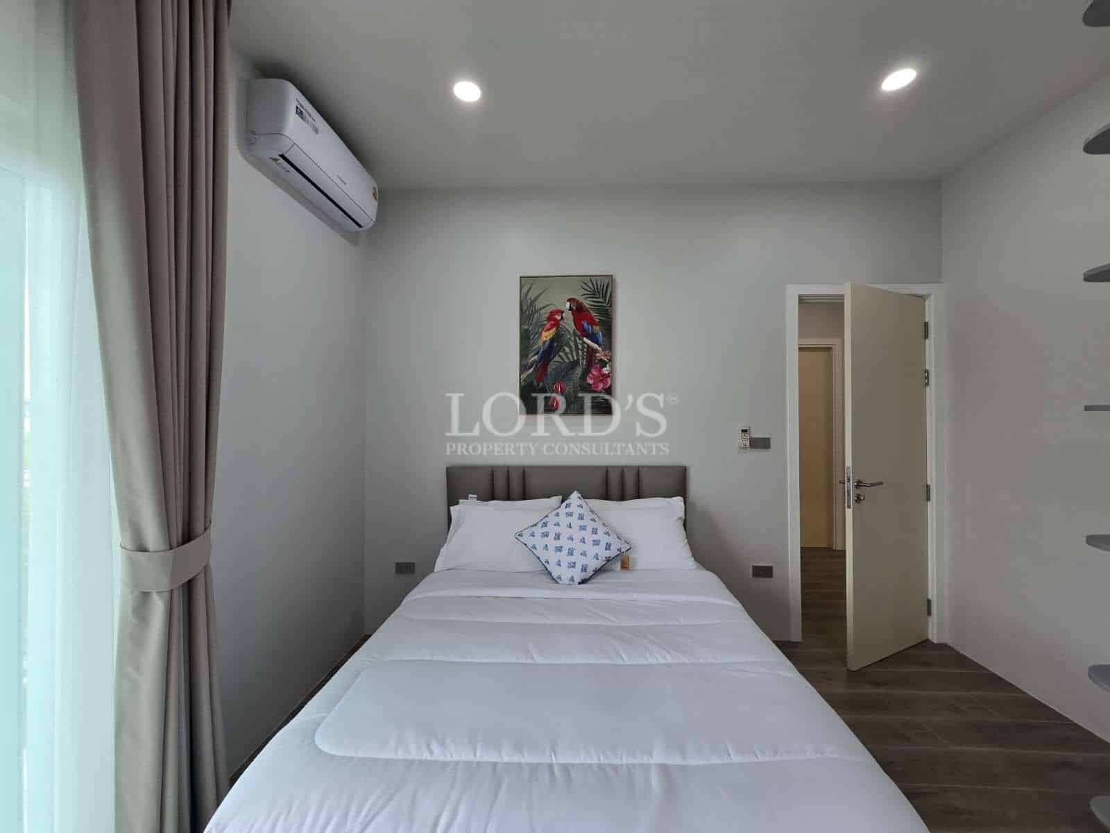 Modern bedroom with artwork and amenities