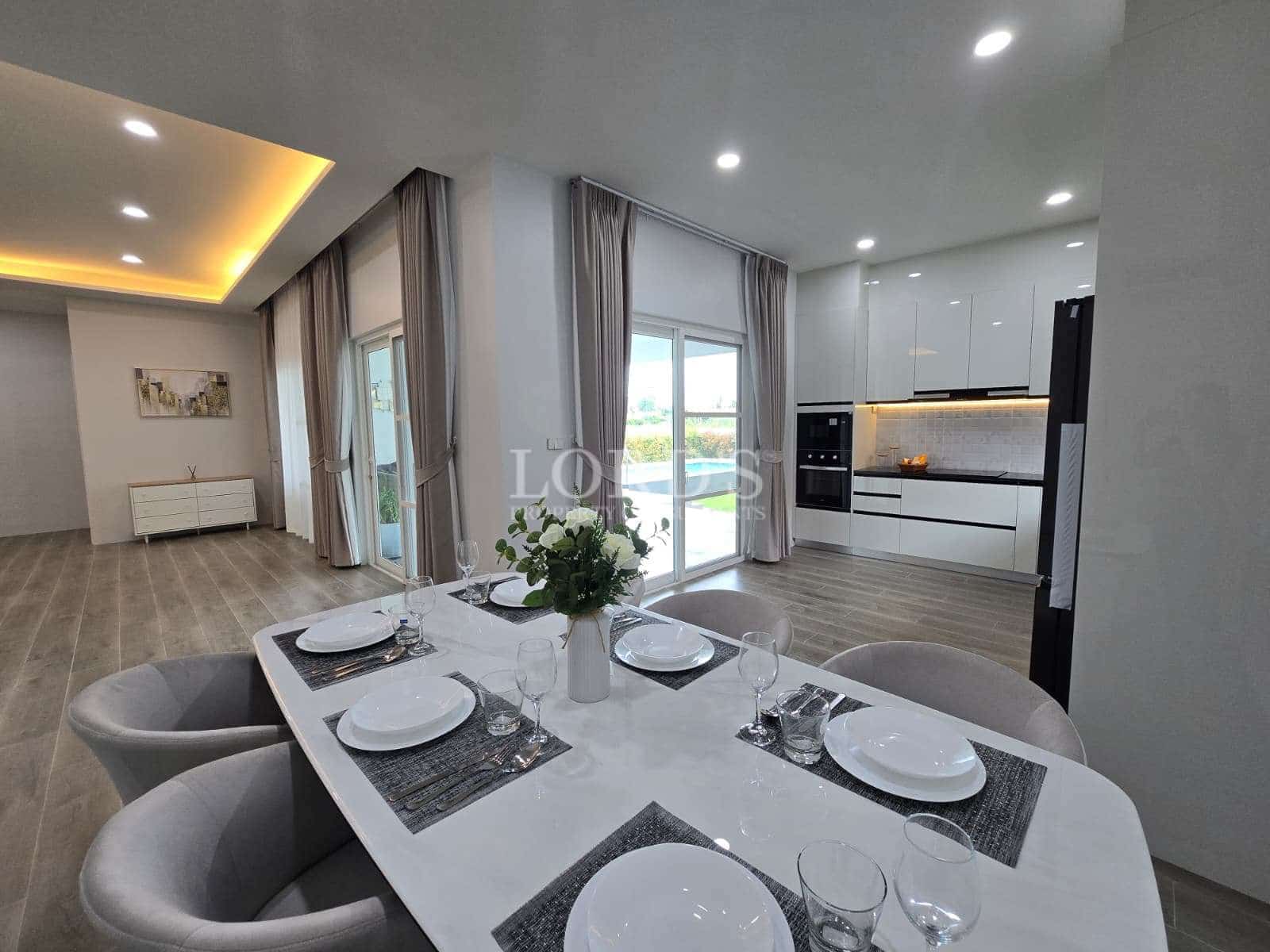 Modern dining area with kitchen view