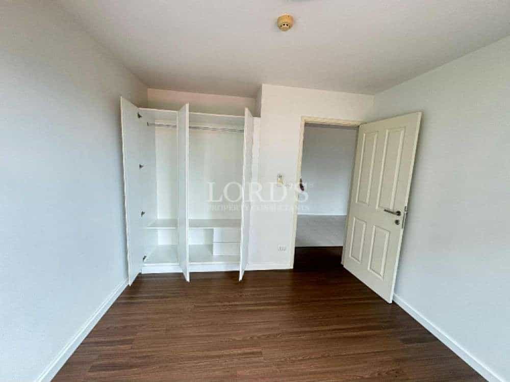 Empty room with closet and door
