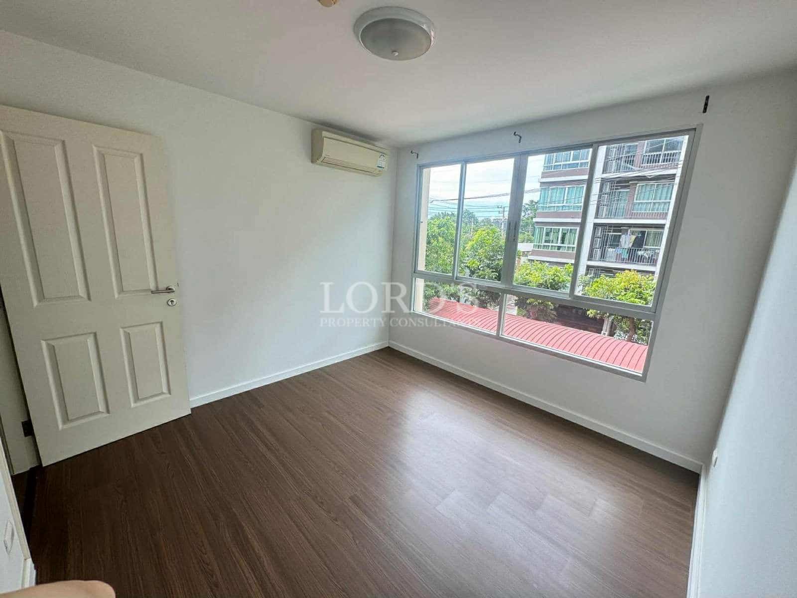 Empty room with large windows