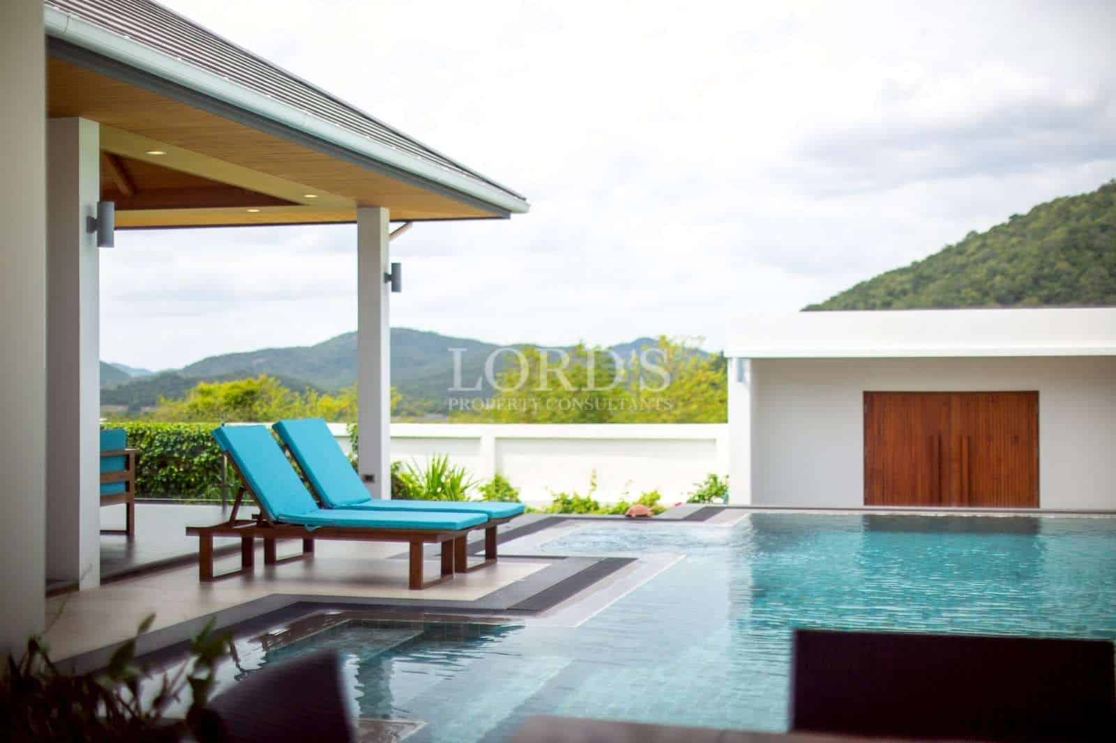 Modern poolside with mountain view