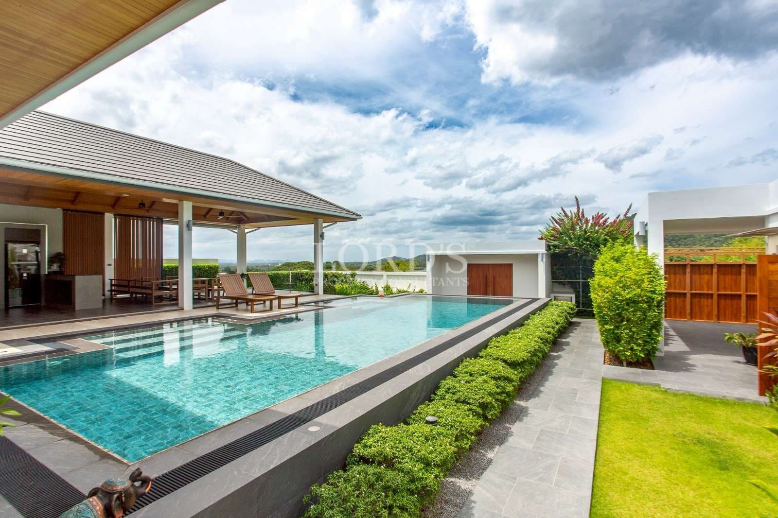 Modern villa with pool and greenery