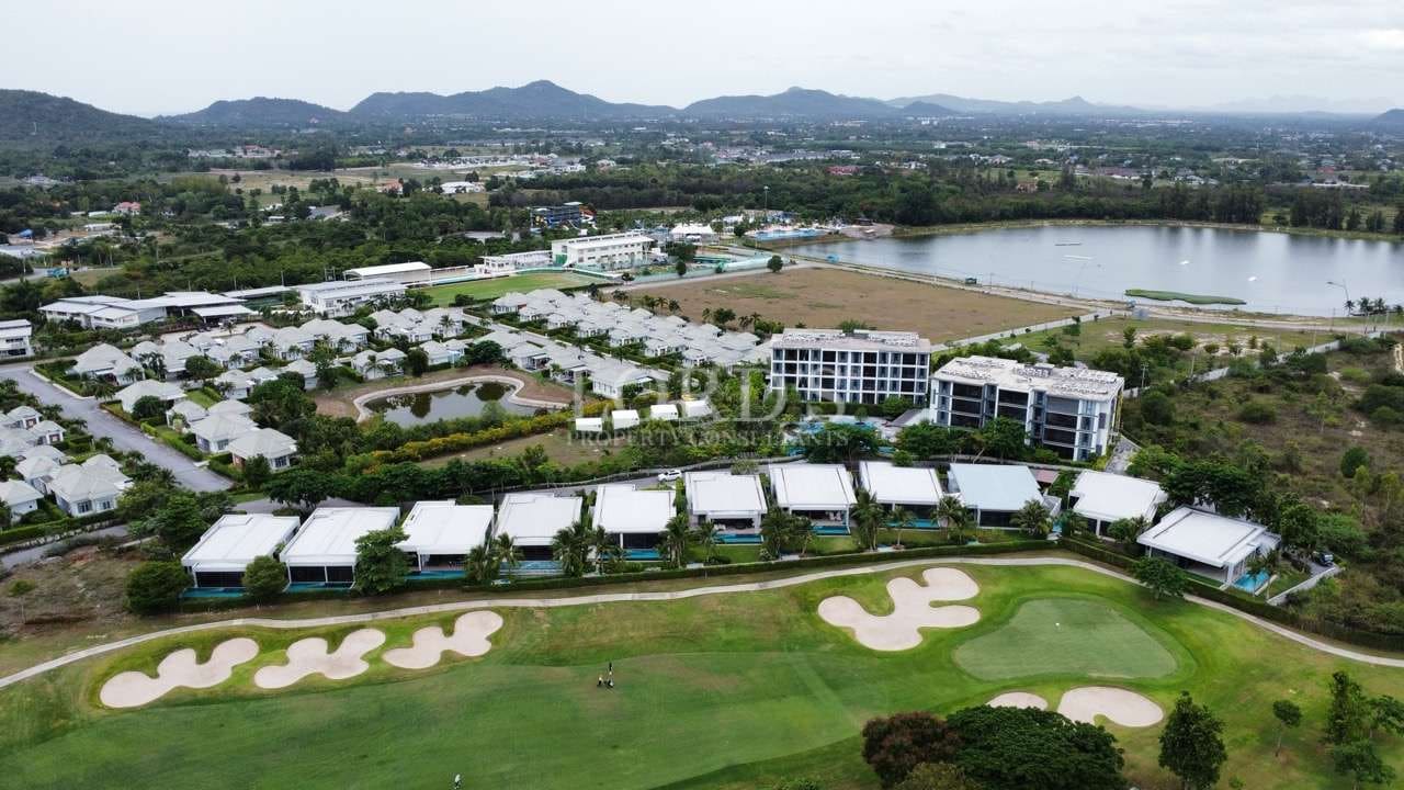 Aerial view of golf course and homes.