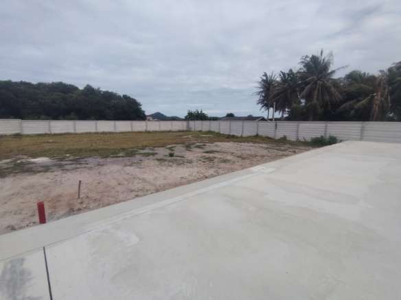 Empty lot with surrounding trees