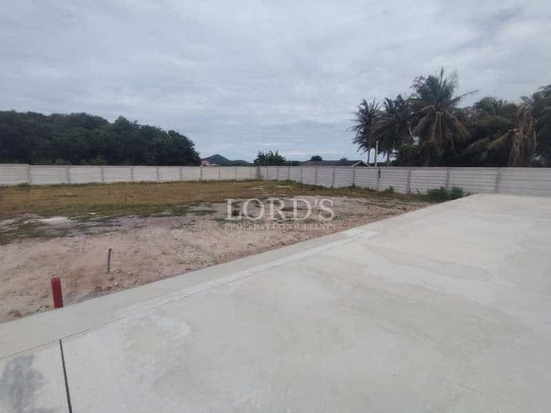 Empty lot with surrounding trees