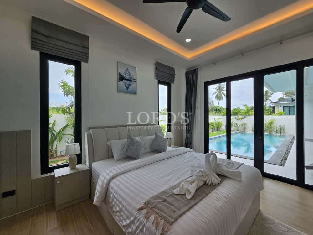 Modern bedroom with pool view