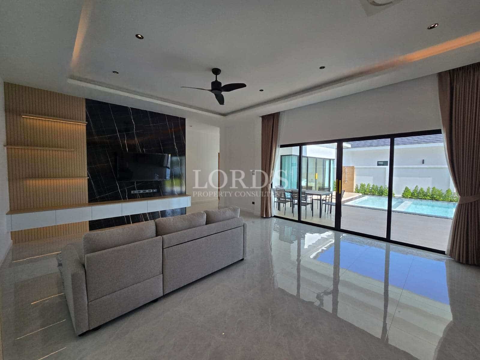 Modern living room with pool view