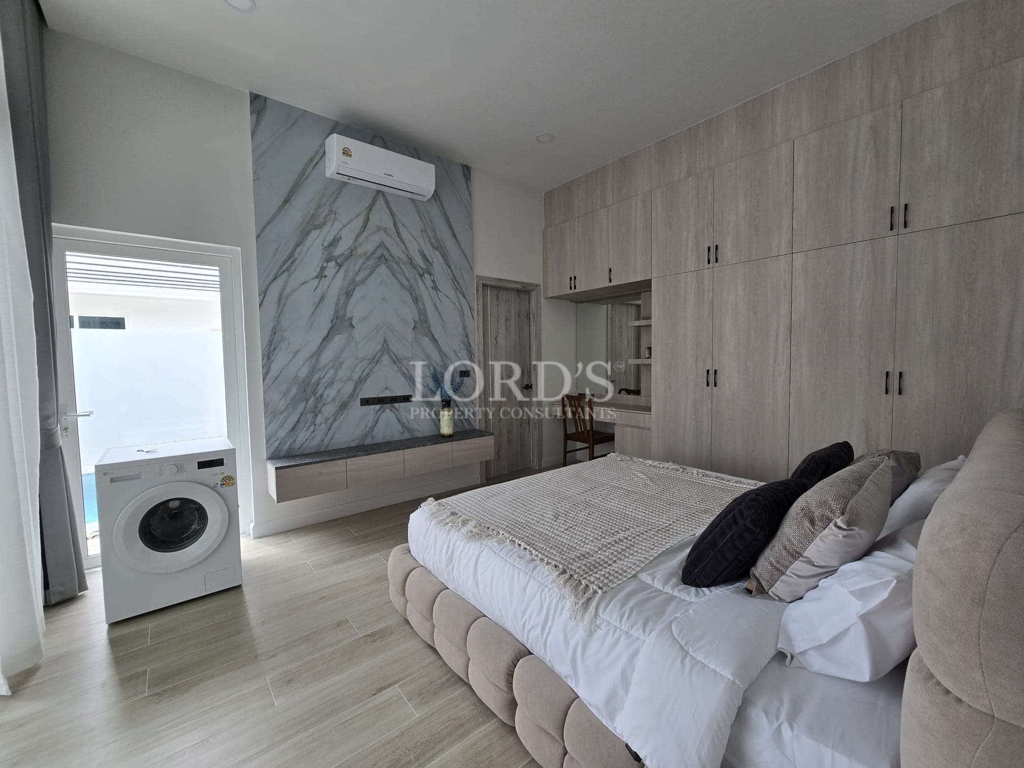 Modern bedroom with laundry area