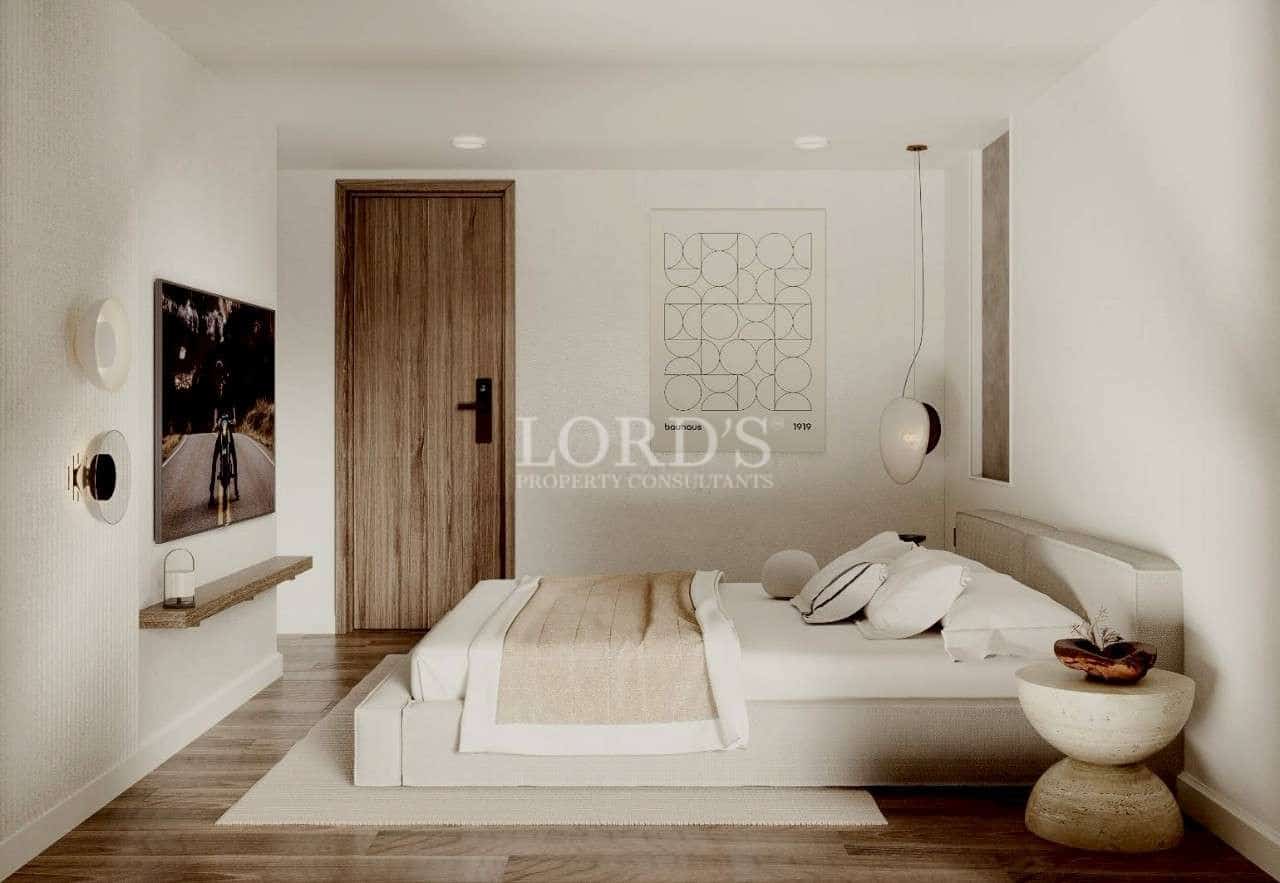 Minimalist modern bedroom with low platform bed, neutral tones, and soft ambient lighting.
