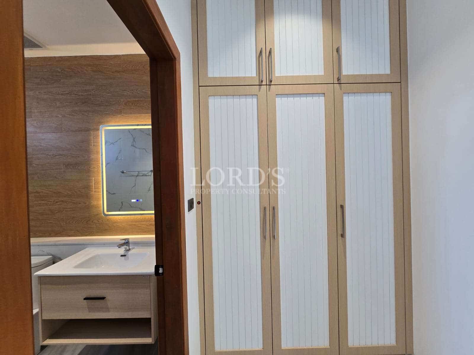 Modern bathroom with storage cabinets