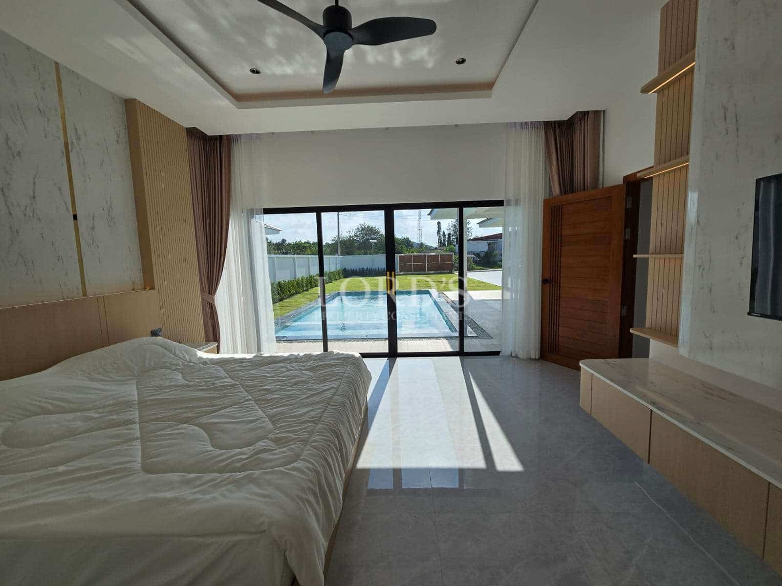 Modern bedroom with pool view