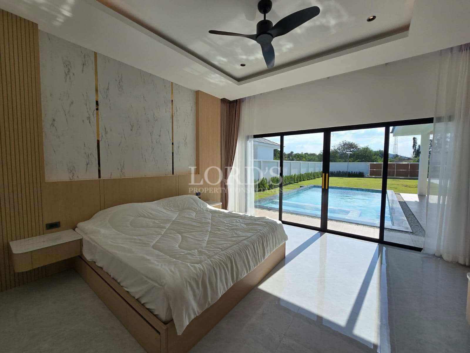 Modern bedroom with pool view