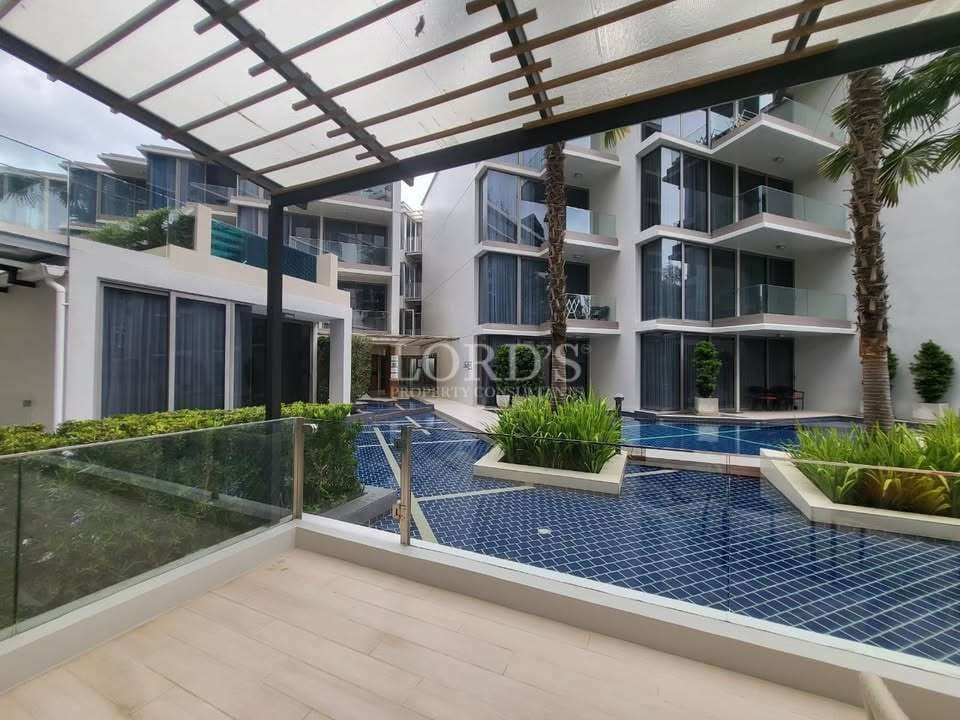 Modern condominium courtyard with swimming pool and pergola terrace.