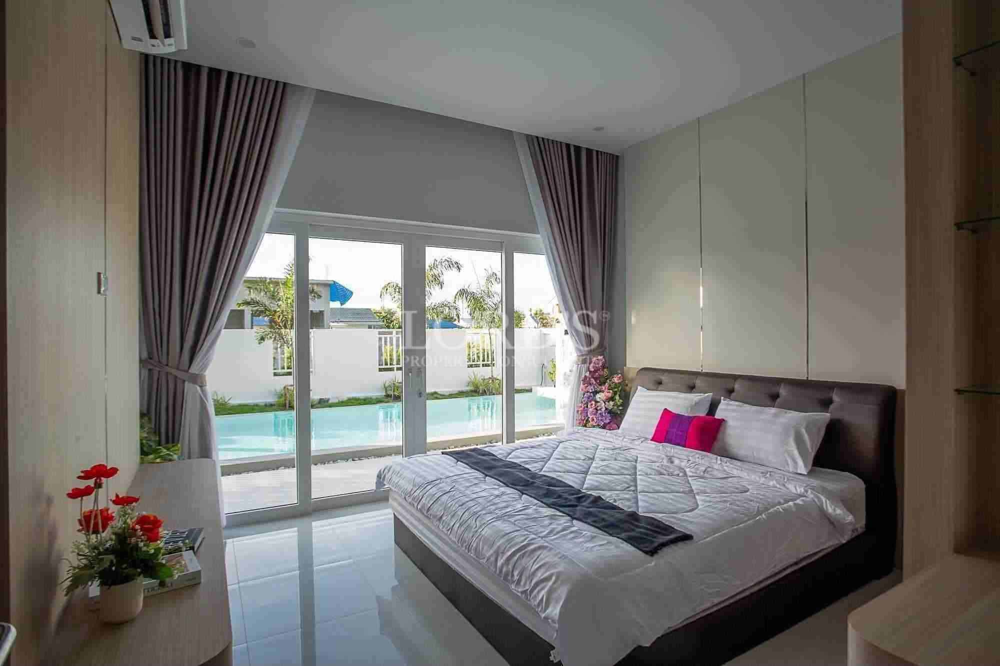 Modern bedroom with pool view