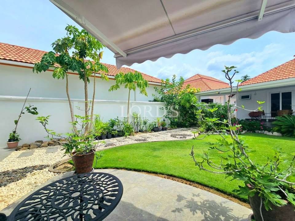Lush garden with patio seating area