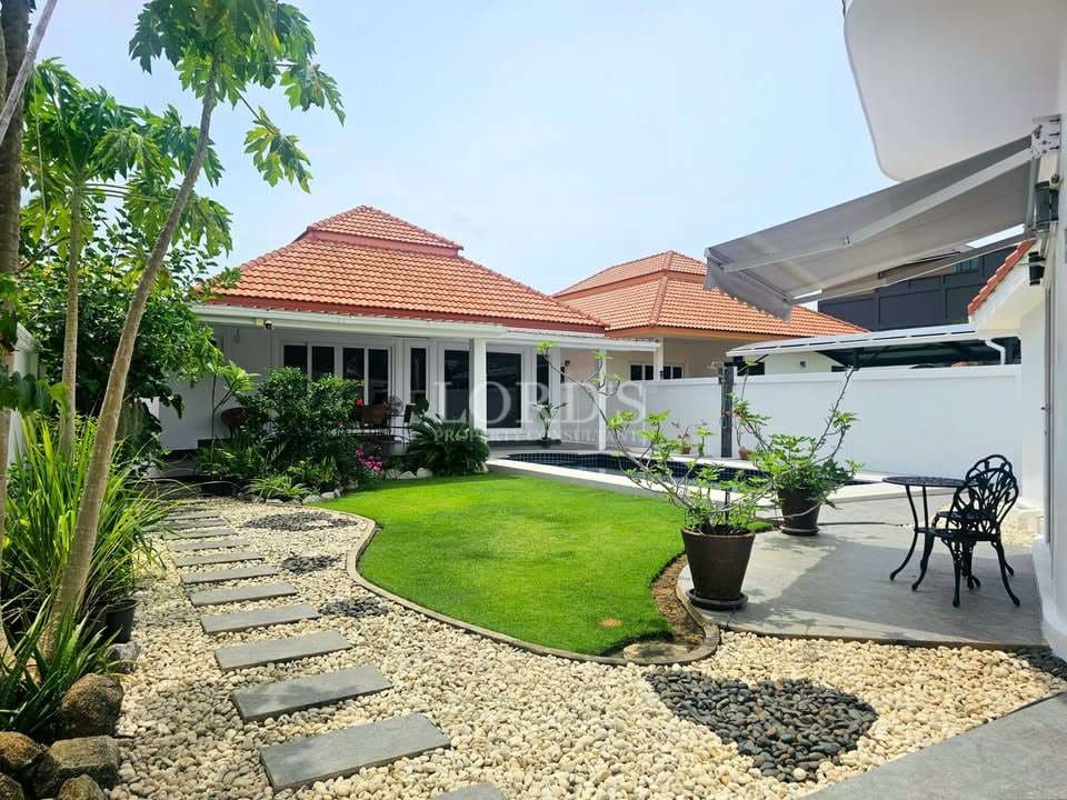 Lush garden with modern architecture.