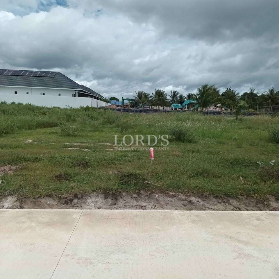 Empty lot with cloudy sky backdrop