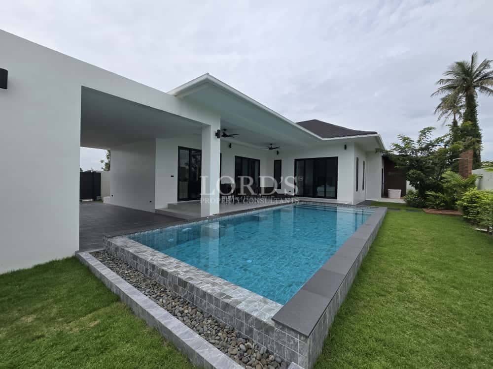 Modern single-story villa with private swimming pool and landscaped garden.