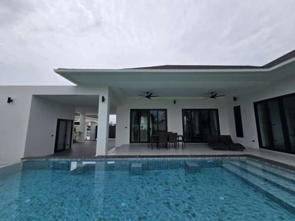 Modern villa with covered terrace and private swimming pool.