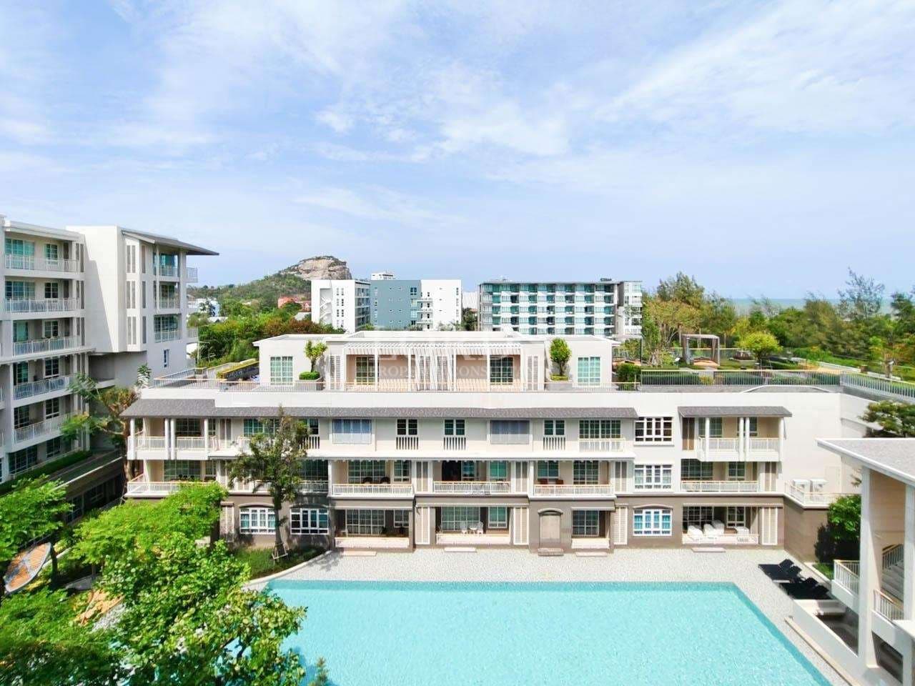 Modern buildings surrounding a swimming pool