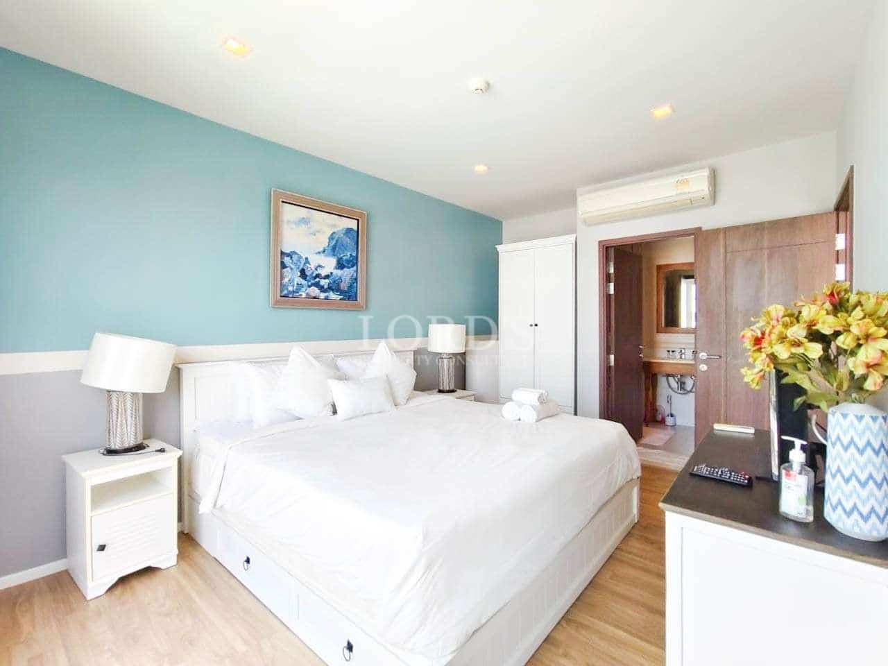 Bright, modern bedroom with decor.