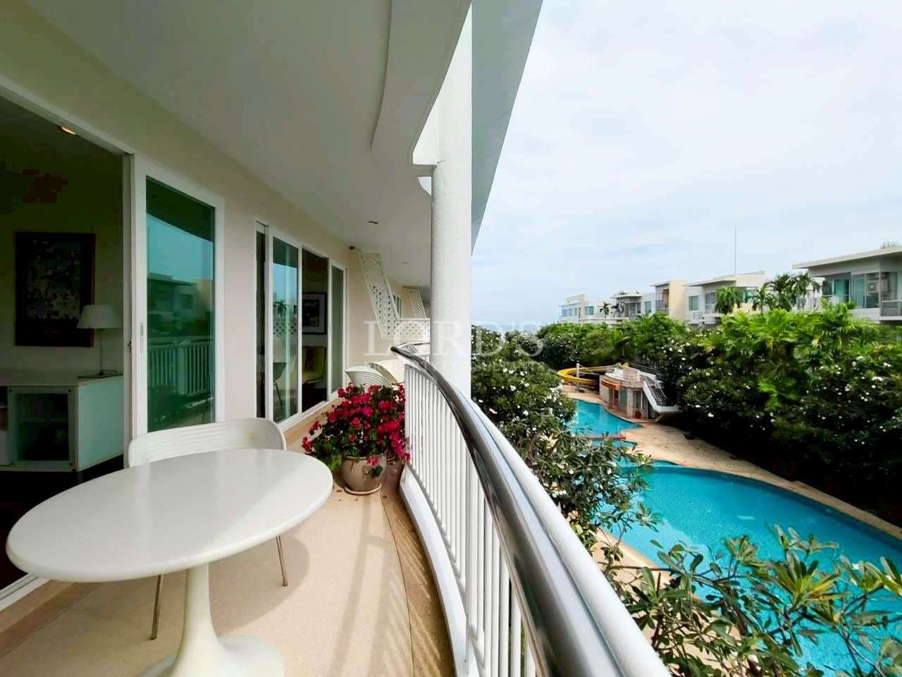Balcony view overlooking pool and greenery