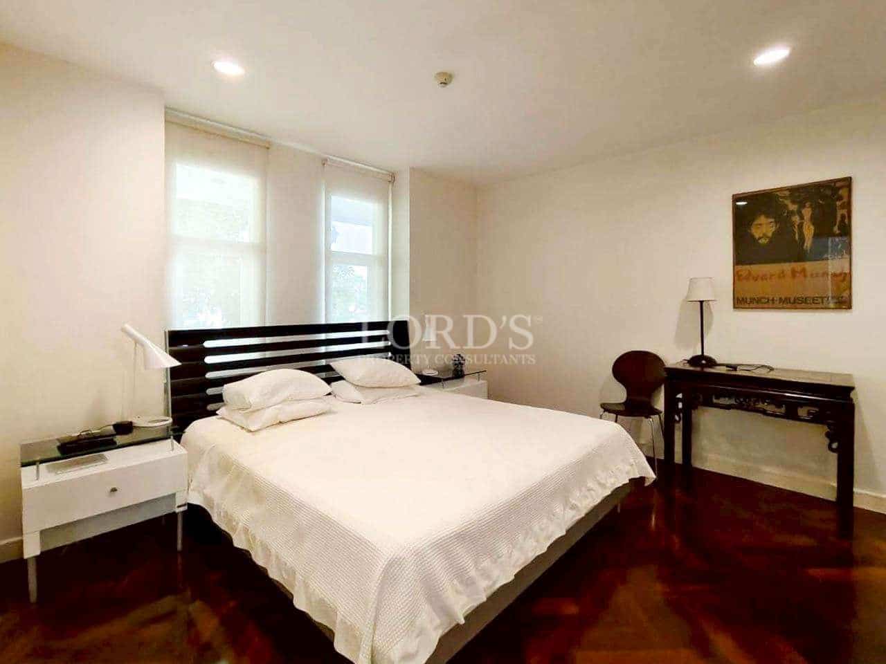 Minimalist bedroom with wooden furniture