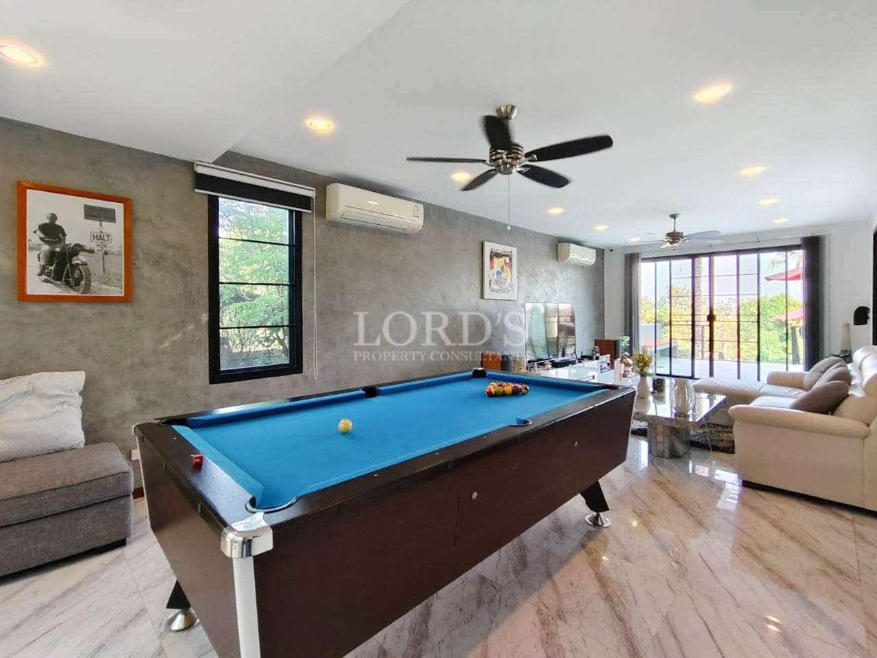 Modern living room with pool table