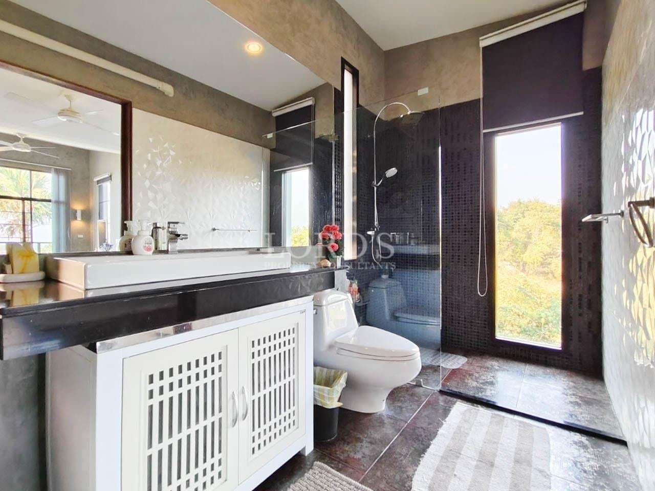 Modern bathroom with large windows