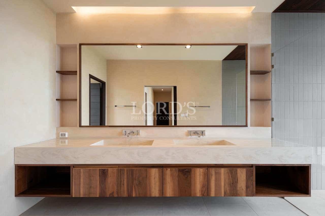 Modern bathroom with large mirror