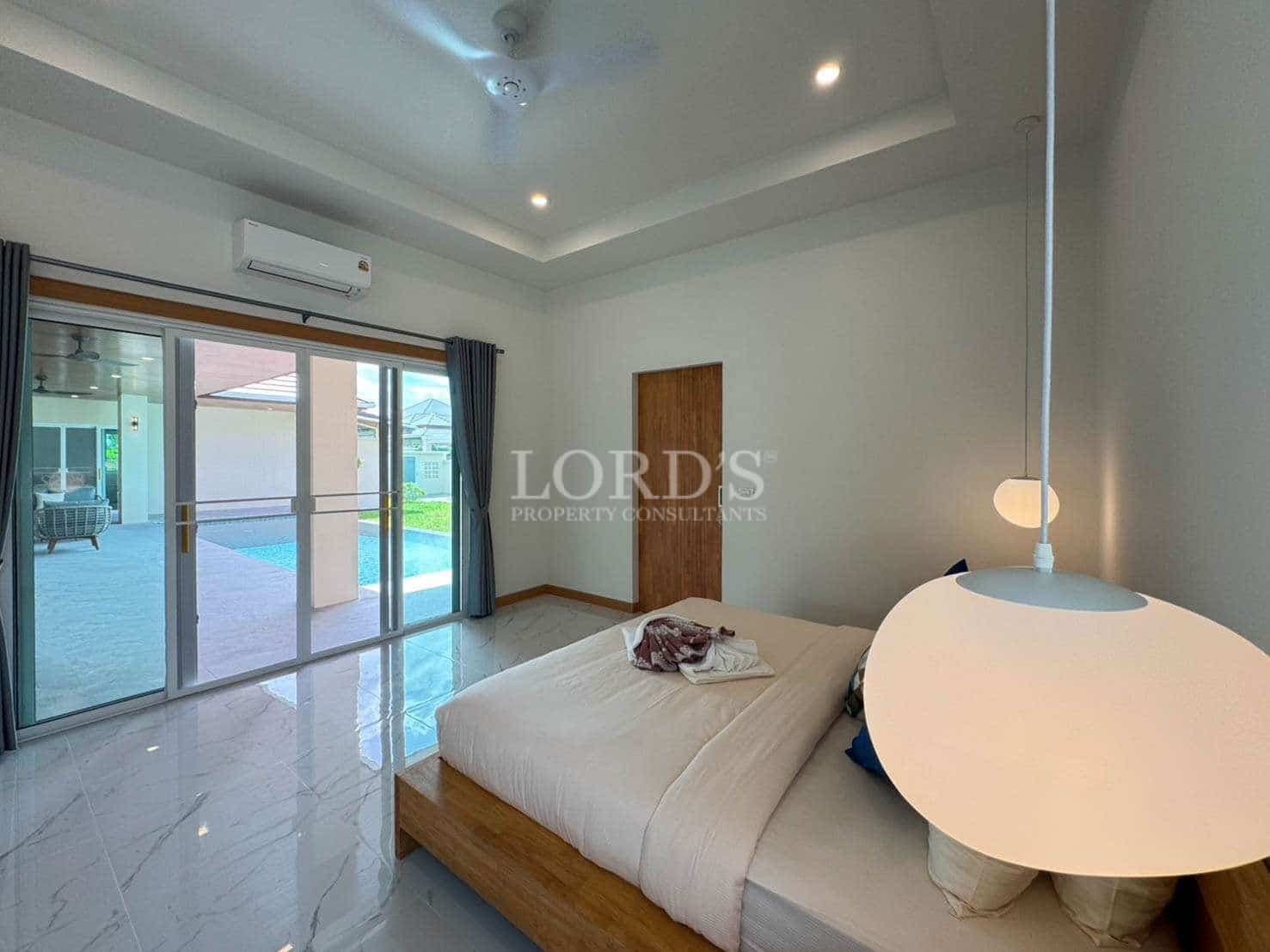 Modern bedroom with large windows