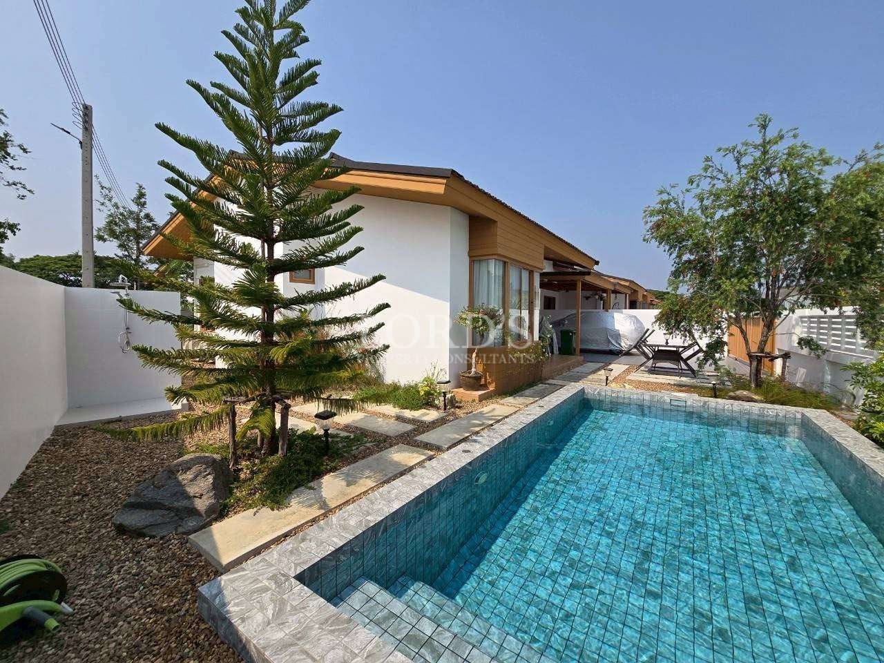 Modern house with pool and greenery