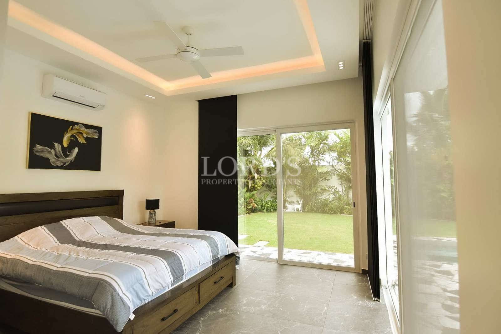 Modern bedroom with large windows