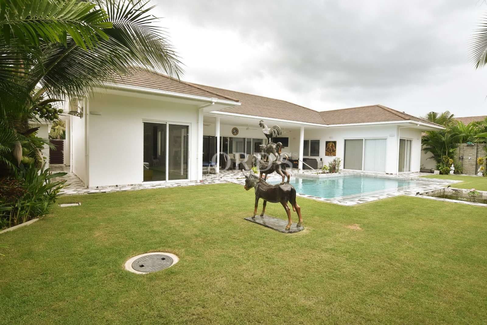 Modern house with pool and sculpture
