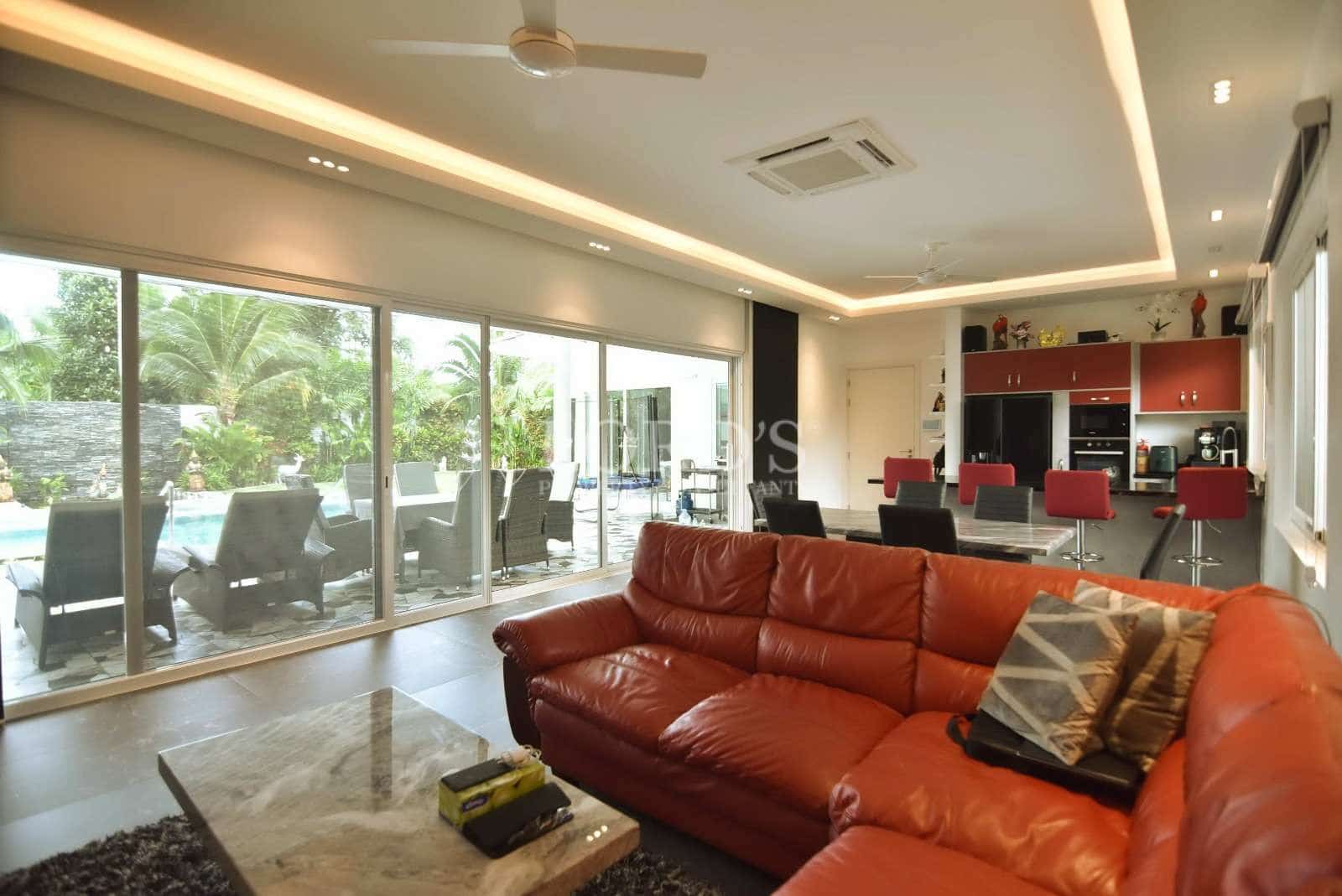 Modern living room with pool view