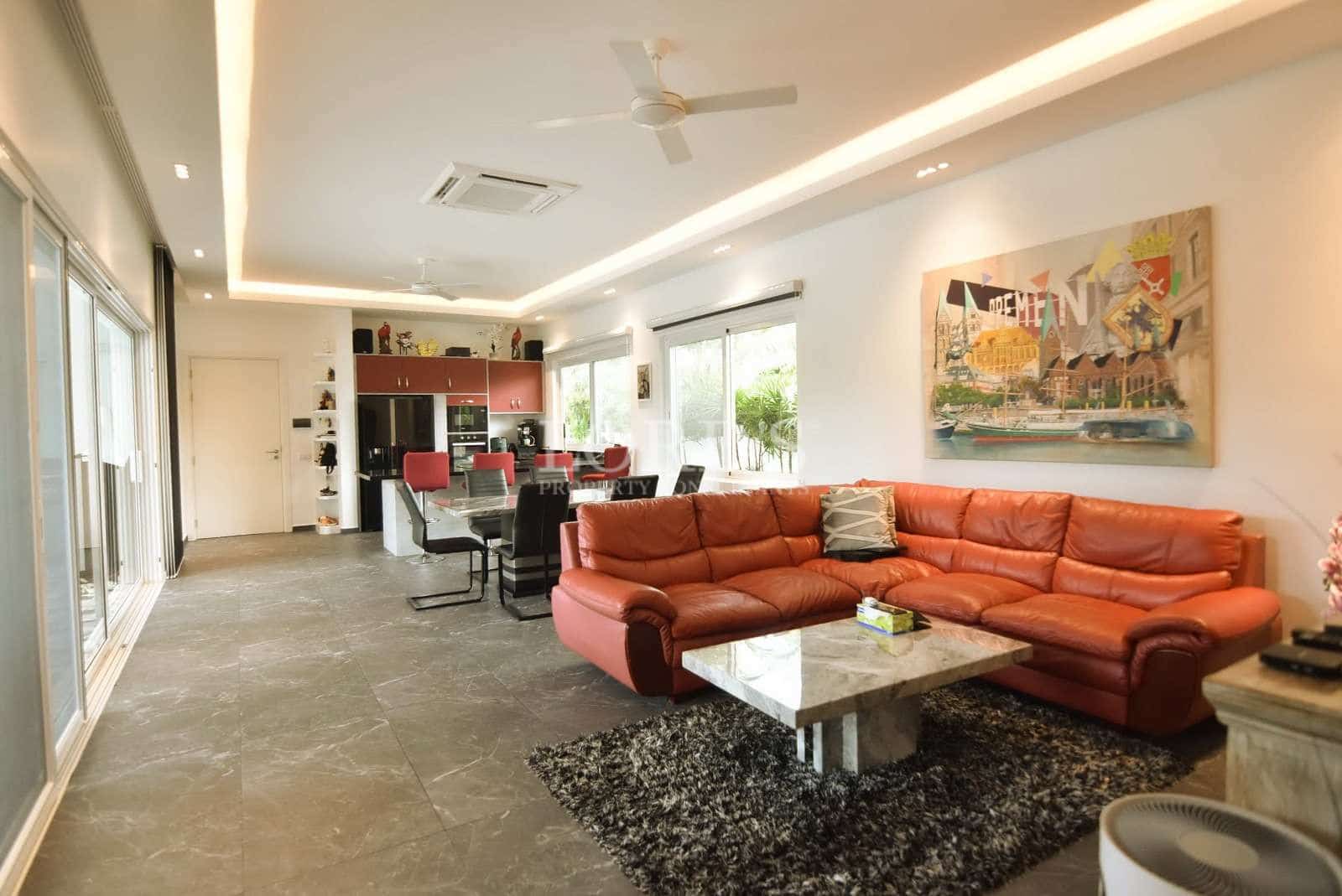 Modern living room with red sofa