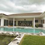 Modern villa with pool and greenery