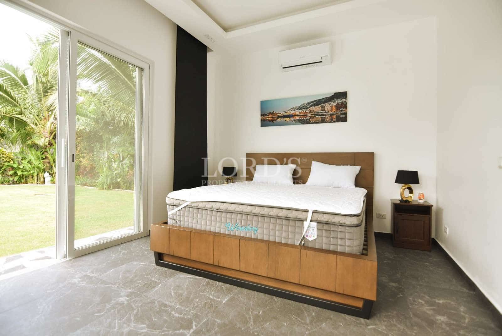 Modern bedroom with large window