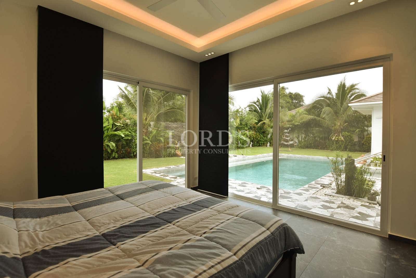 Modern bedroom with pool view
