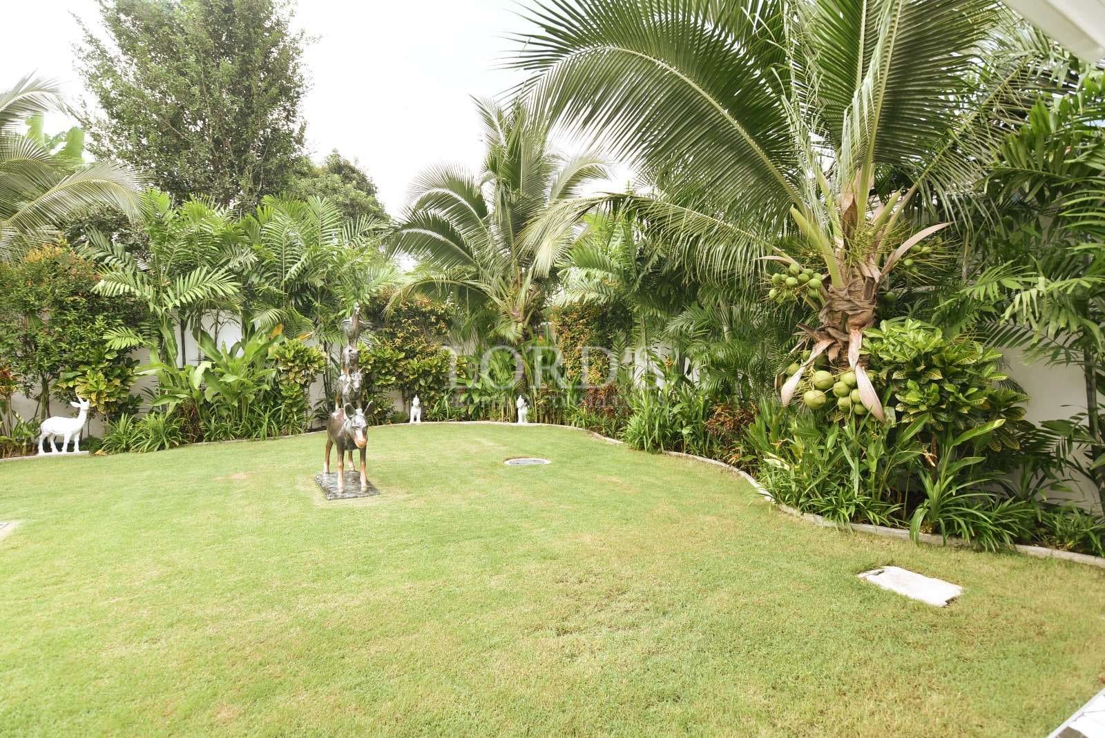 Lush garden with decorative animals.