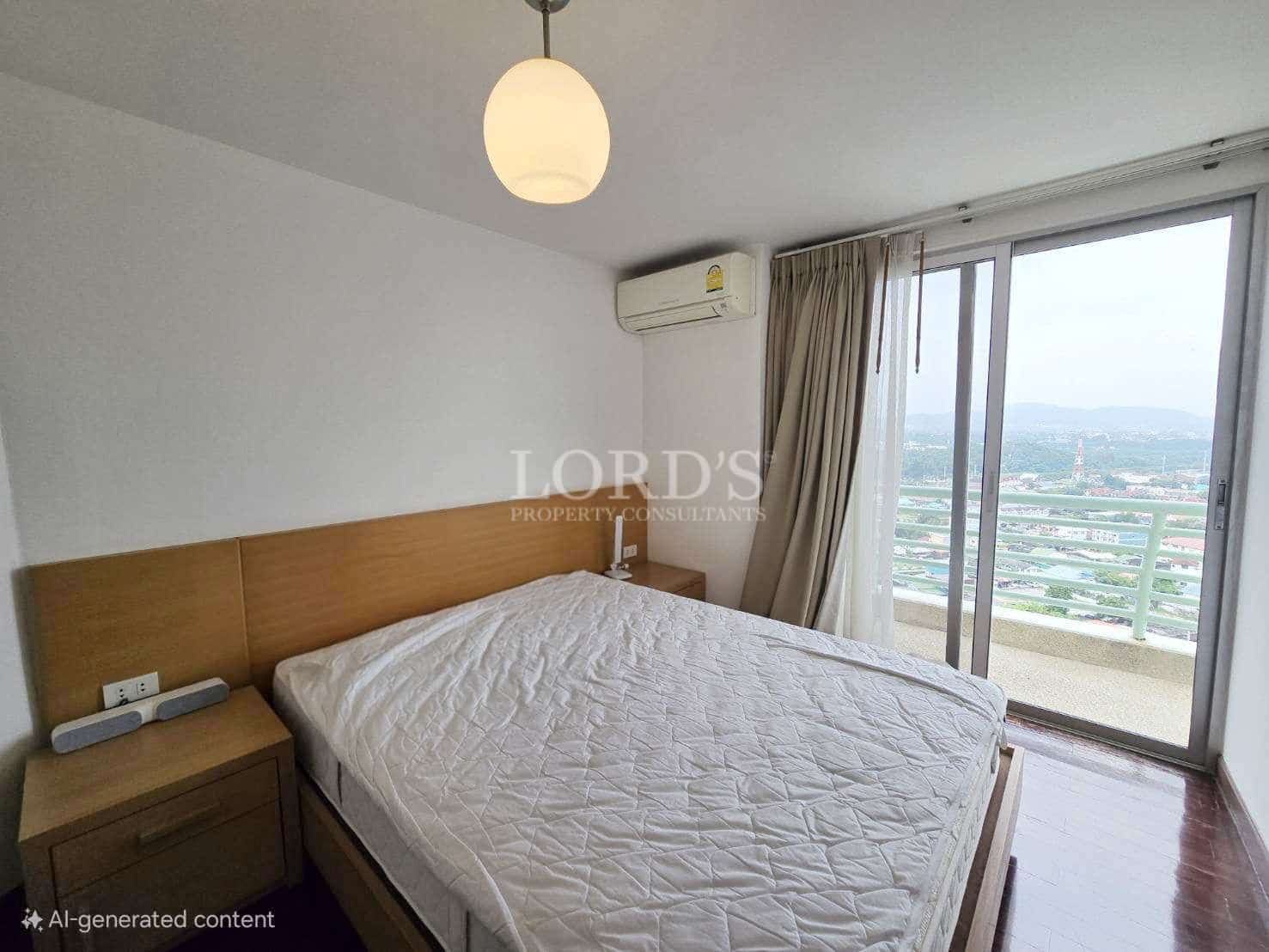 Bright bedroom with wooden bed frame, sliding glass balcony doors, and city view.