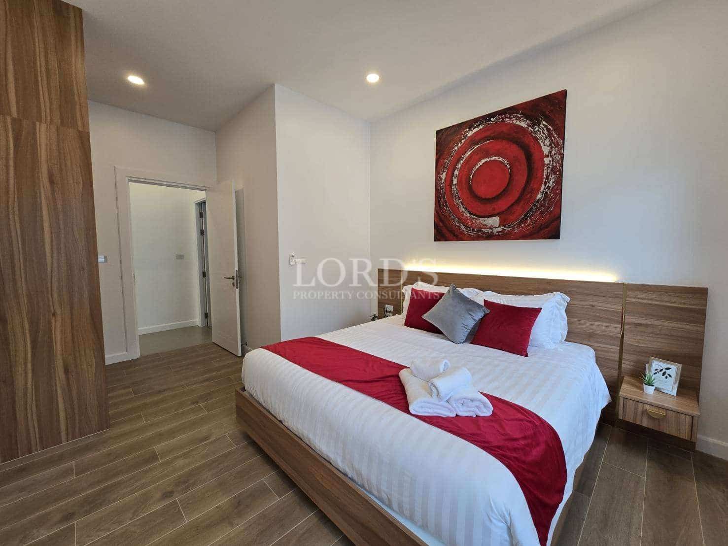 Modern bedroom with red accents