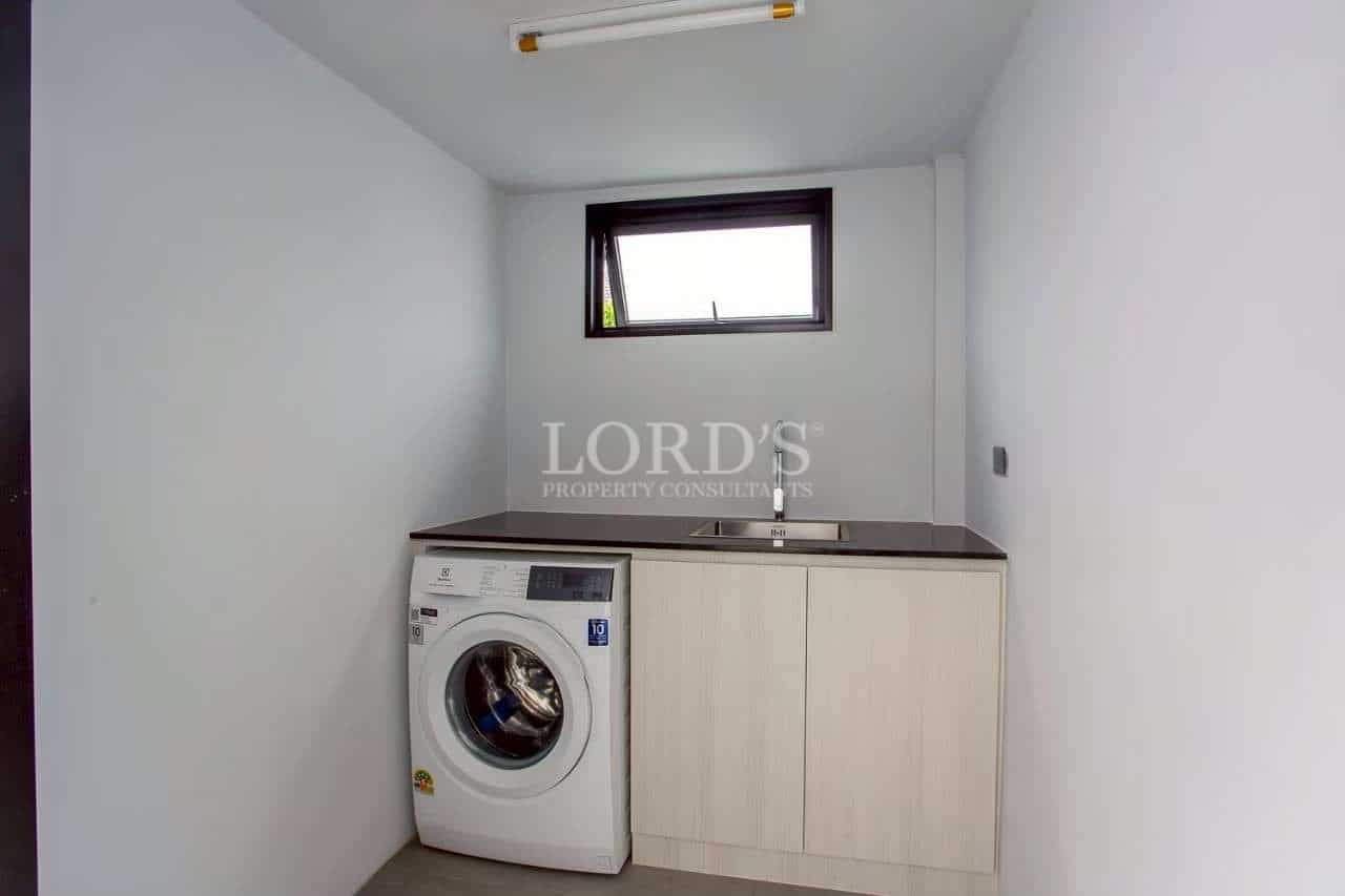 Laundry room with washing machine
