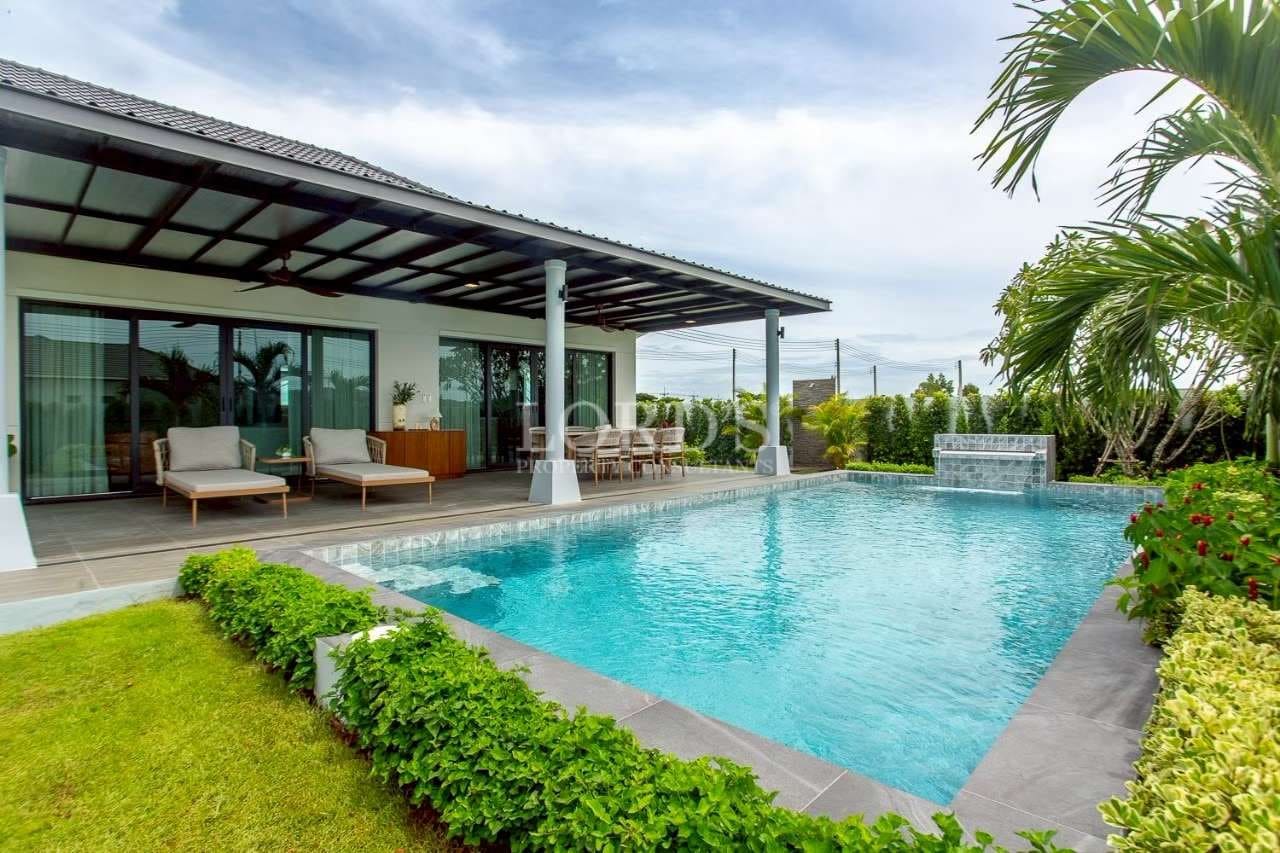 Modern villa with pool and greenery