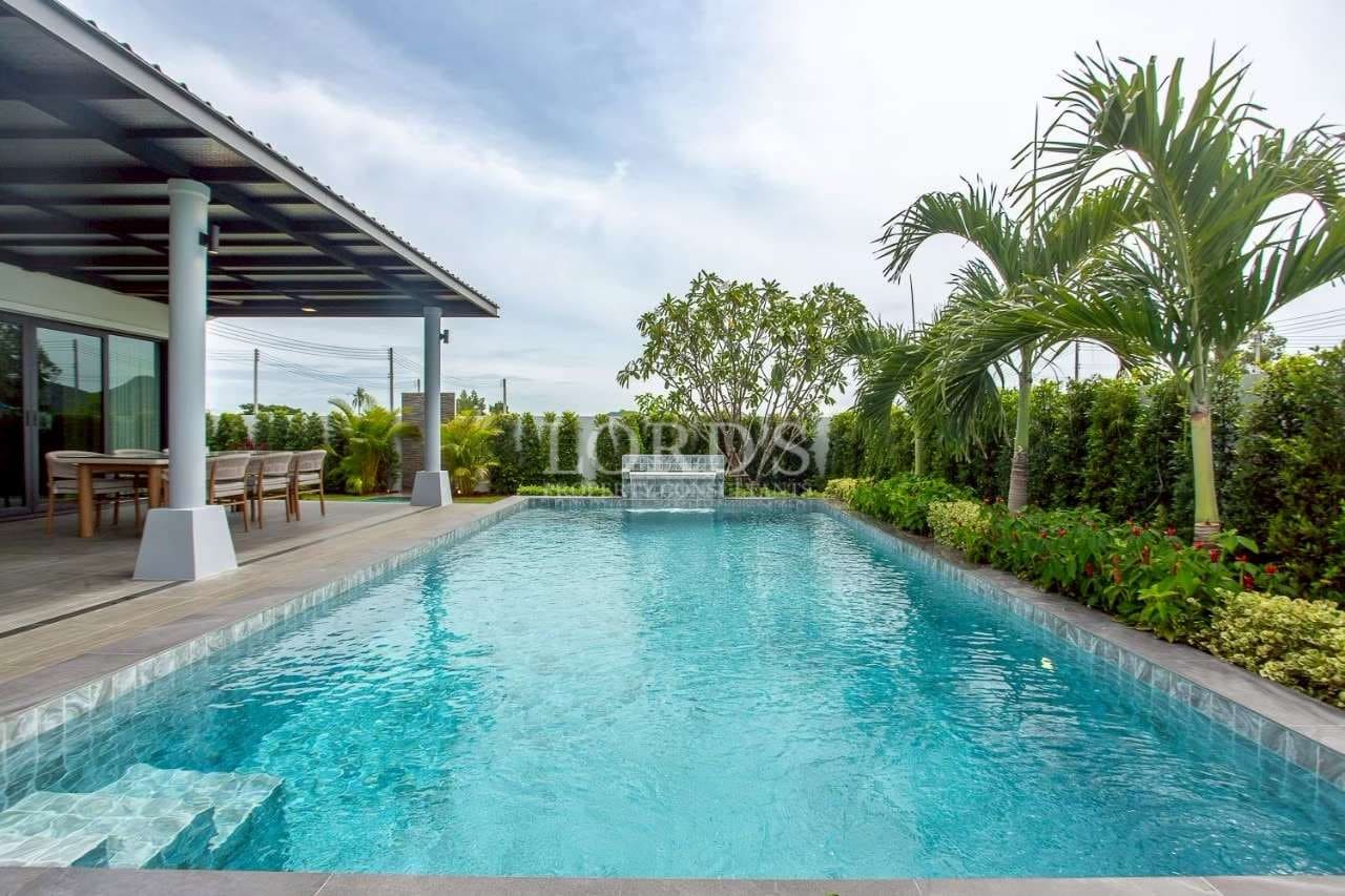 Luxury pool surrounded by greenery