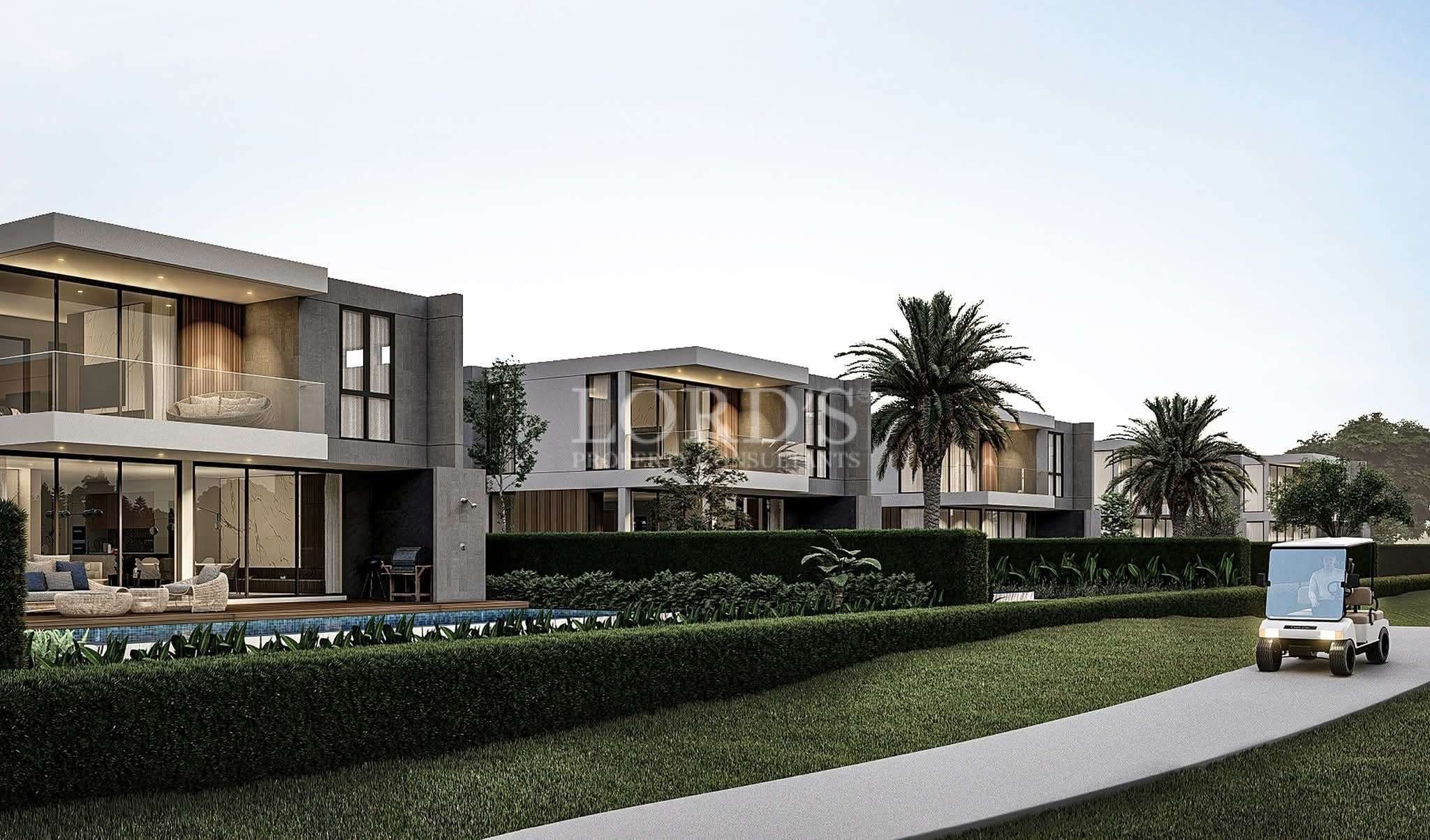 Luxury residential community with modern two-story villas, landscaped greenery, private pools, and palm-lined pathways.
