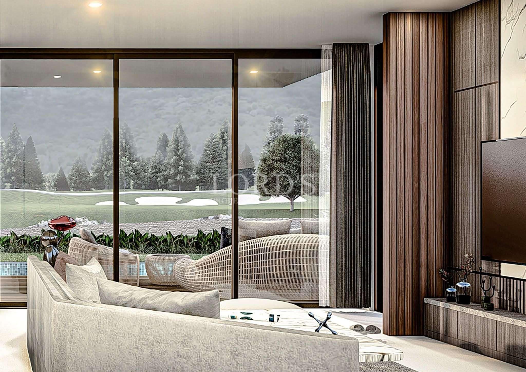 Luxury living room with floor-to-ceiling glass doors, modern sofa, wood-paneled walls, and scenic outdoor views.