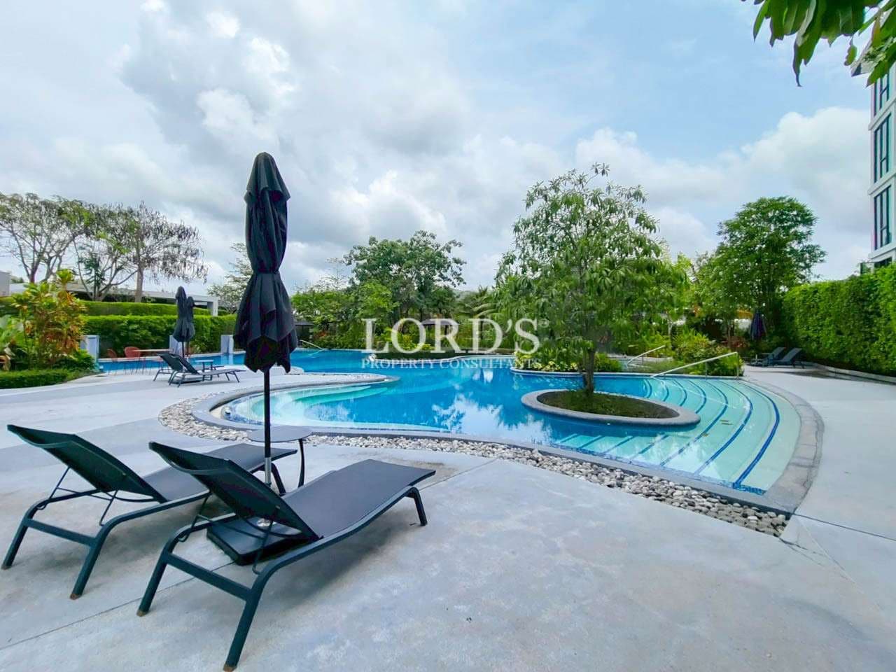 Swimming pool with lounge chairs