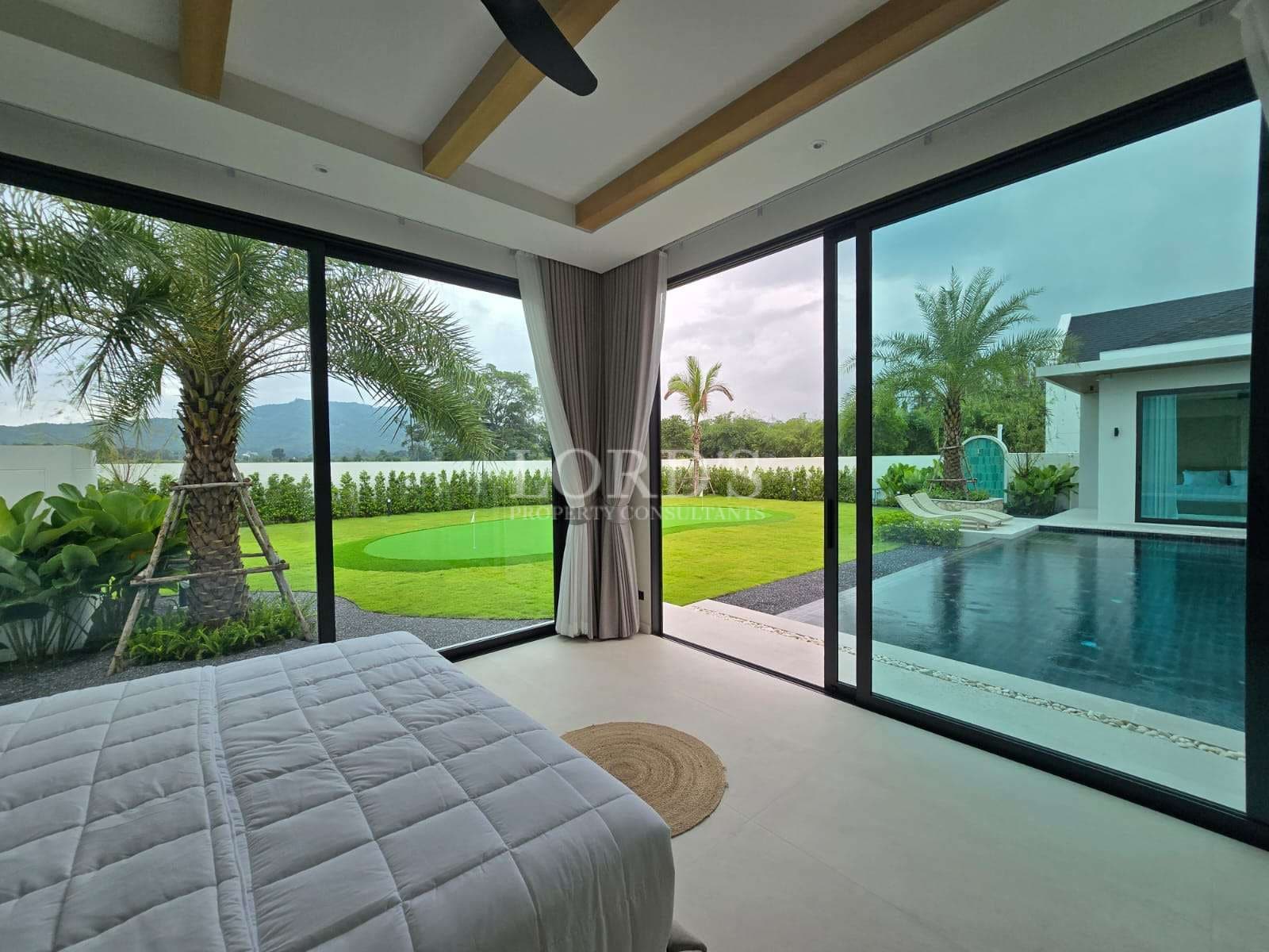 Modern bedroom with pool view